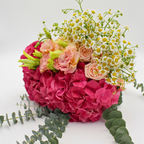 hydrangeas with eucalyptus, roses, eustomas packed for a flower subscription box from a fresh flower wholesaler 