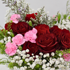 red roses and rose sprays with baby's breaths packed for a flower subscription box from a fresh flower wholesaler 